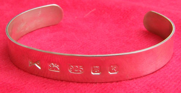 Plain bangle with featured hallmarks