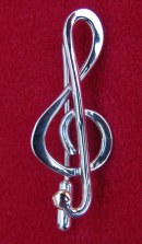 Treble clef brooch