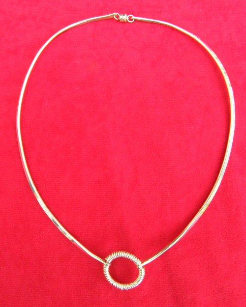 Split circle choker with coiled feature