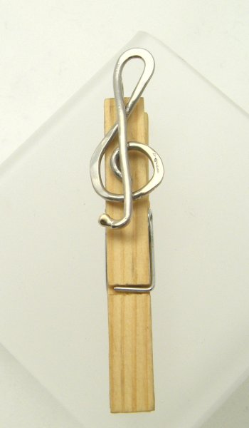 Treble clef brroch as a a music stand clip