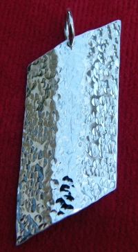 Disk trapezium pendant