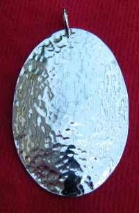 Disk oval pendant