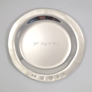 A shallow solid silver bonbon dish.  This one has been hand engraved with a special date