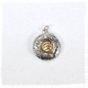 Small round textured cast pendant