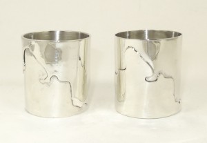 Silver napkin rings showing the Thames Path