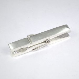 Shiny silver clothes peg