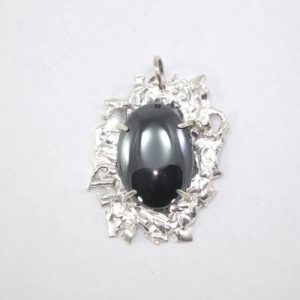 Fused silver pendant with haematite