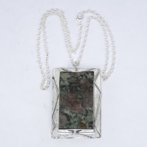 Silver pendant mount for a mineral sample