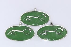 Silver Uffington White Horses on a green background