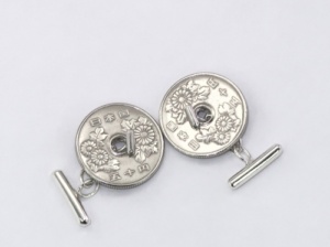 Simple silver cufflinks for a coin with a hole at the centre