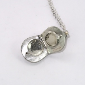 Silver teardrop locket inside