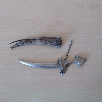 As received silver dagger brooch