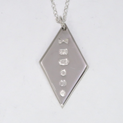 Large diamond ingot pendant with coronation mark