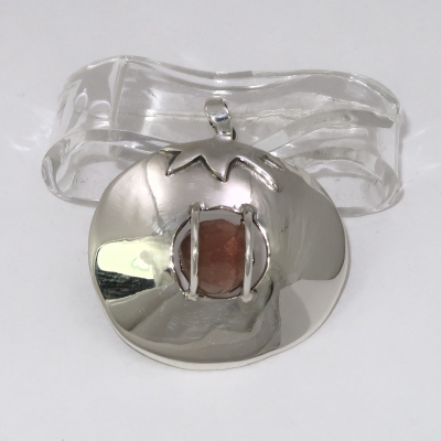 Sunstone in a tomato shaped silver pendant
