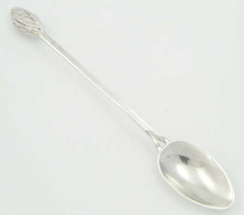 Spoon with olive stone